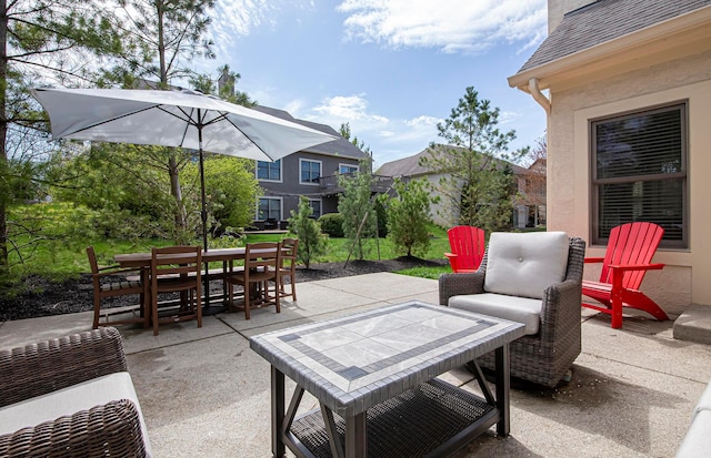 view of patio featuring outdoor dining area