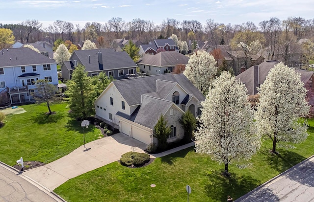 birds eye view of property with a residential view