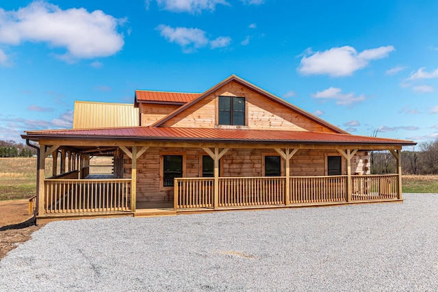 view of front of home featuring metal roof and covered porch