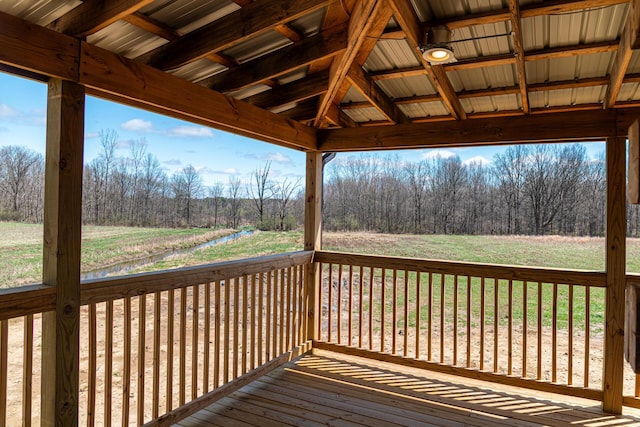 wooden terrace featuring a yard
