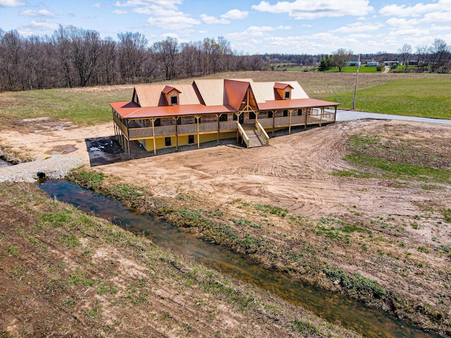 birds eye view of property with a wooded view