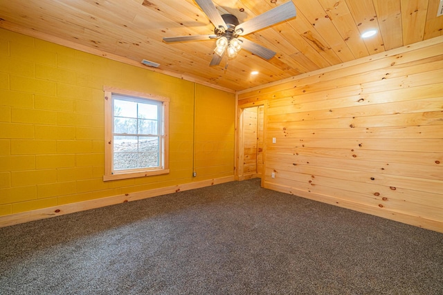 unfurnished room with wood ceiling, ceiling fan, and carpet