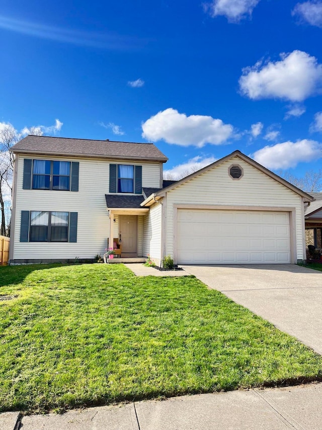 1581 Ringfield Dr, Galloway, OH 43119 - traditional-style home featuring concrete driveway, a front yard, and an attached garage