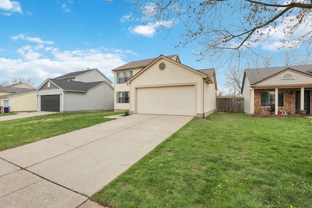 1581 Ringfield Dr, Galloway, OH 43119 - view of front of property featuring a garage, fence, driveway, and a front lawn