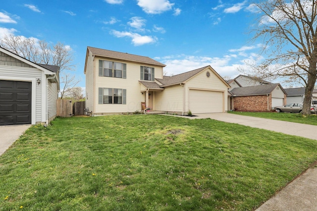 1581 Ringfield Dr, Galloway, OH 43119 - traditional-style house with a front lawn, fence, an attached garage, and concrete driveway