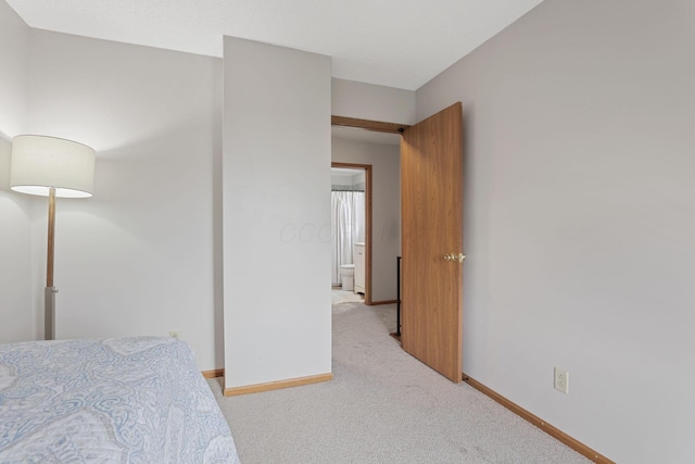 1581 Ringfield Dr, Galloway, OH 43119 - bedroom with light carpet and baseboards