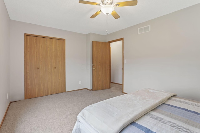 1581 Ringfield Dr, Galloway, OH 43119 - carpeted bedroom featuring baseboards, visible vents, a closet, and a ceiling fan