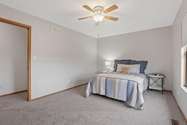 1581 Ringfield Dr, Galloway, OH 43119 - carpeted bedroom featuring visible vents, baseboards, a ceiling fan, and a textured ceiling