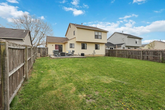 1581 Ringfield Dr, Galloway, OH 43119 - back of property featuring a patio area, a fenced backyard, and a yard