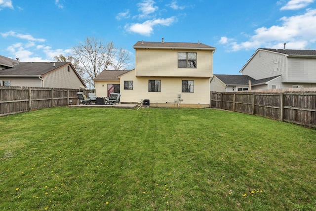 1581 Ringfield Dr, Galloway, OH 43119 - rear view of house with a patio area, a yard, and a fenced backyard