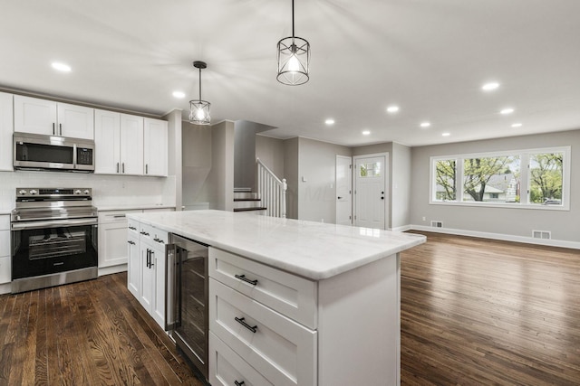 kitchen with stainless steel appliances, wine cooler, recessed lighting, dark wood-type flooring, and backsplash