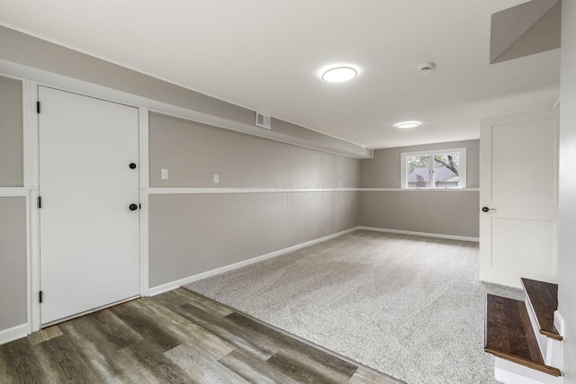 below grade area with baseboards and wood finished floors