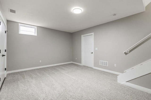 basement with carpet and baseboards