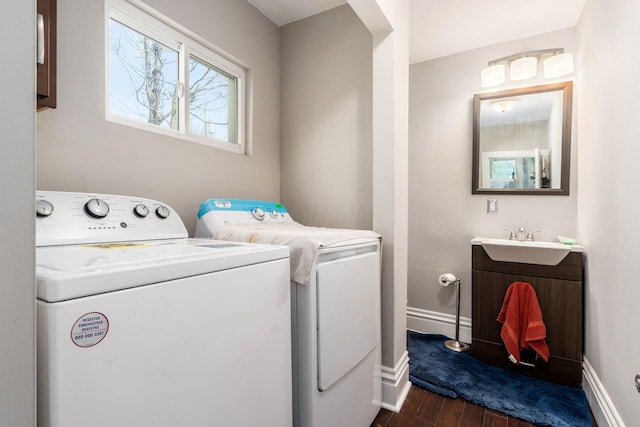 444 S 22nd St, Columbus, OH 43205 - laundry area featuring washer and dryer, dark wood-style flooring, and baseboards