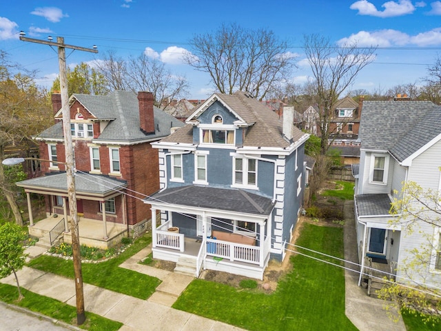 444 S 22nd St, Columbus, OH 43205 - victorian home featuring a porch, a chimney, and a residential view