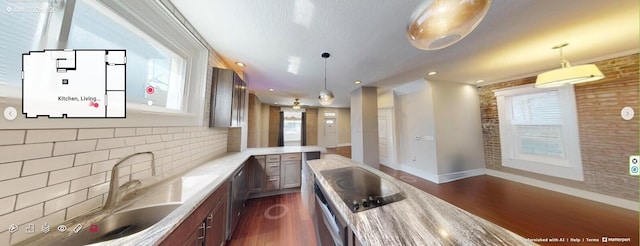 444 S 22nd St, Columbus, OH 43205 - kitchen featuring dark wood-type flooring, baseboards, light countertops, backsplash, and decorative light fixtures