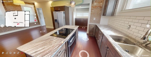444 S 22nd St, Columbus, OH 43205 - kitchen featuring white refrigerator with ice dispenser, dark wood finished floors, a sink, black electric cooktop, and tasteful backsplash