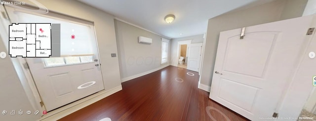 444 S 22nd St, Columbus, OH 43205 - entrance foyer with dark wood-type flooring, a wall mounted AC, and baseboards