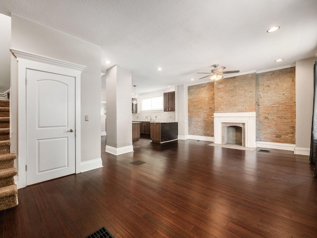 444 S 22nd St, Columbus, OH 43205 - unfurnished living room with a ceiling fan, stairs, dark wood-style floors, baseboards, and recessed lighting