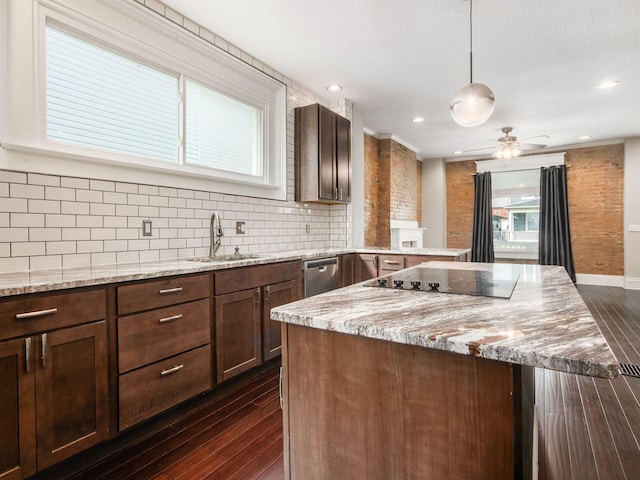 444 S 22nd St, Columbus, OH 43205 - kitchen with a sink, dark wood-type flooring, black electric cooktop, a peninsula, and tasteful backsplash