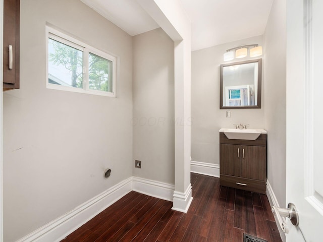 444 S 22nd St, Columbus, OH 43205 - bathroom with baseboards, wood finished floors, and vanity