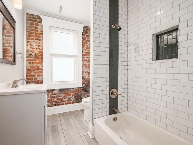444 S 22nd St, Columbus, OH 43205 - full bath featuring vanity, toilet, baseboards, wood finished floors, and bathing tub / shower combination