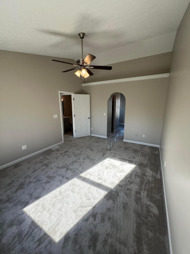796 Village Park Dr, Powell, OH 43065 - unfurnished bedroom featuring carpet flooring, baseboards, arched walkways, and lofted ceiling