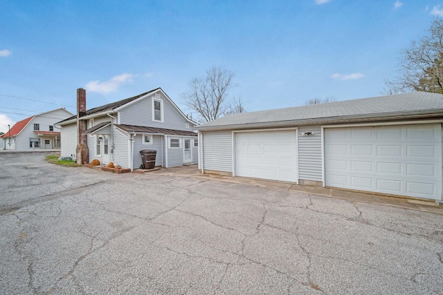 view of front of home featuring an outbuilding