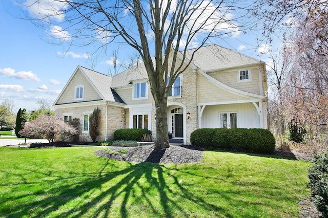 6795 Macneil Dr, Dublin, OH 43017 - view of front facade featuring a front yard and stone siding