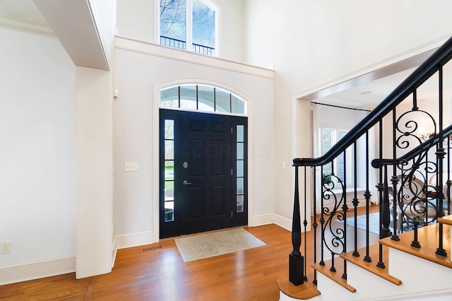 6795 Macneil Dr, Dublin, OH 43017 - entryway with baseboards, wood finished floors, and a healthy amount of sunlight