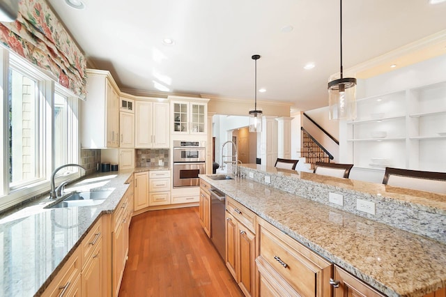 6795 Macneil Dr, Dublin, OH 43017 - kitchen with crown molding, appliances with stainless steel finishes, and a sink