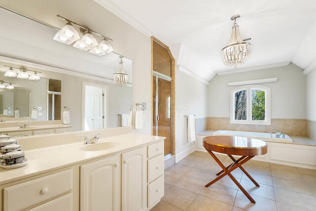 6795 Macneil Dr, Dublin, OH 43017 - full bath featuring ornamental molding, tile patterned floors, a shower stall, and a chandelier