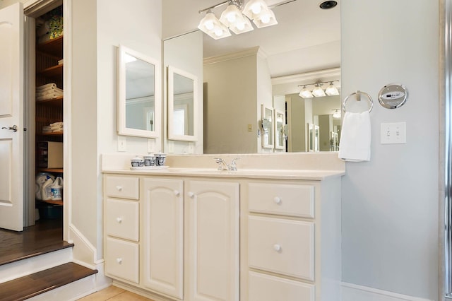 6795 Macneil Dr, Dublin, OH 43017 - bathroom featuring a chandelier, tile patterned flooring, vanity, and ornamental molding