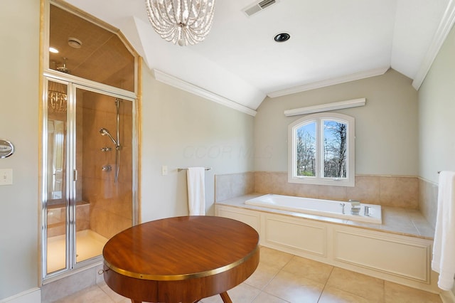 6795 Macneil Dr, Dublin, OH 43017 - full bathroom featuring tile patterned floors, a bath, visible vents, and vaulted ceiling