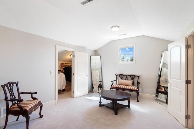 6795 Macneil Dr, Dublin, OH 43017 - living area with light carpet, visible vents, baseboards, and vaulted ceiling
