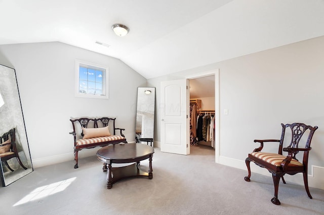 6795 Macneil Dr, Dublin, OH 43017 - sitting room featuring visible vents, baseboards, light colored carpet, and lofted ceiling