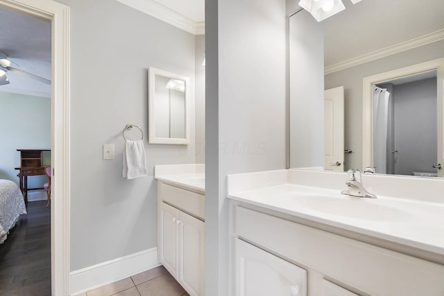 6795 Macneil Dr, Dublin, OH 43017 - ensuite bathroom with ceiling fan, vanity, ensuite bath, ornamental molding, and baseboards
