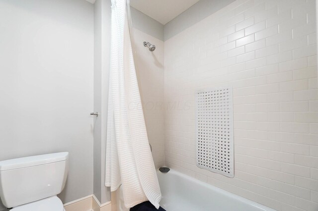 6795 Macneil Dr, Dublin, OH 43017 - bathroom featuring shower / tub combo and toilet