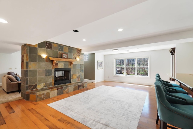 6795 Macneil Dr, Dublin, OH 43017 - living area featuring light wood-type flooring, baseboards, a multi sided fireplace, and recessed lighting