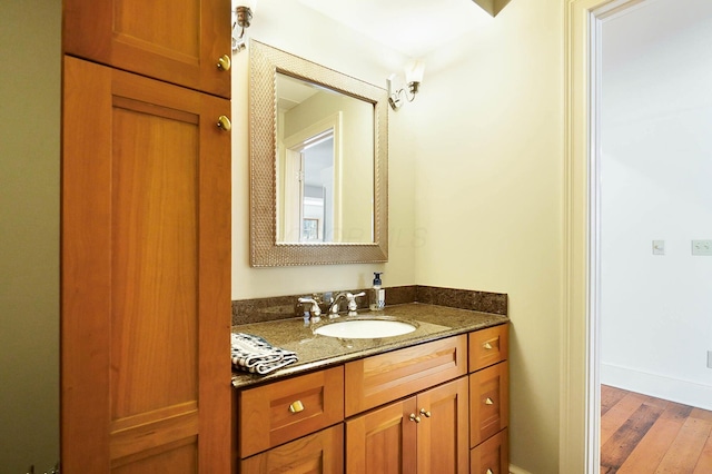 6795 Macneil Dr, Dublin, OH 43017 - bathroom featuring vanity, baseboards, and wood finished floors