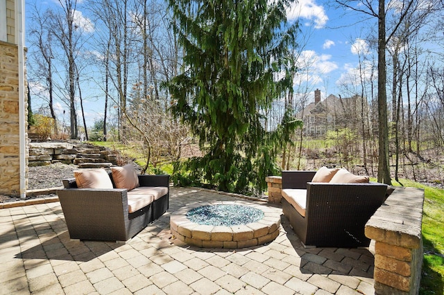 6795 Macneil Dr, Dublin, OH 43017 - view of patio / terrace with an outdoor living space with a fire pit