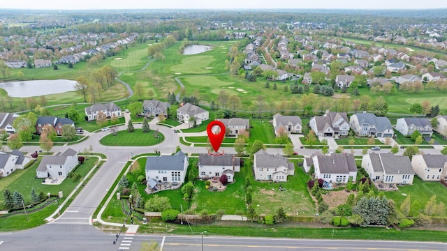 birds eye view of property with a water view, view of golf course, and a residential view