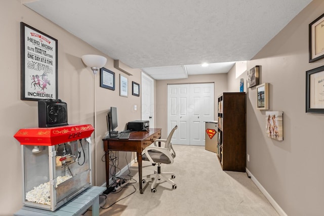 office space featuring baseboards and carpet