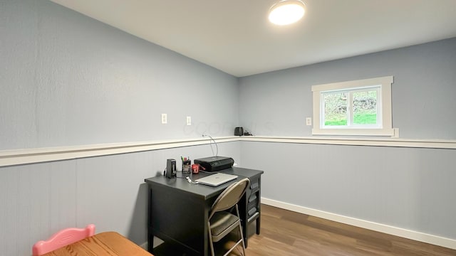 office area featuring baseboards and wood finished floors
