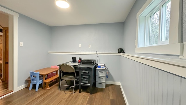 office featuring baseboards and light wood finished floors