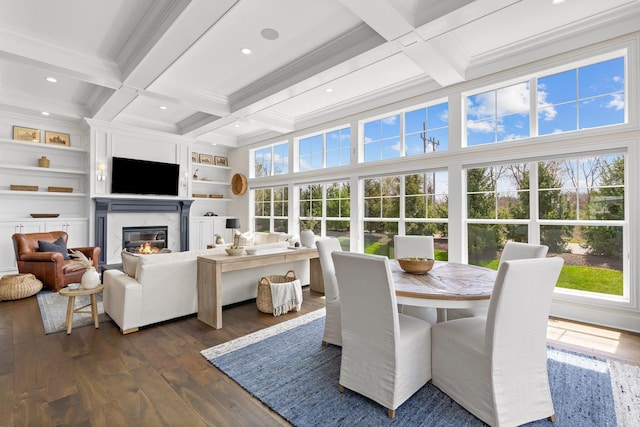 sunroom featuring beam ceiling and coffered ceiling
