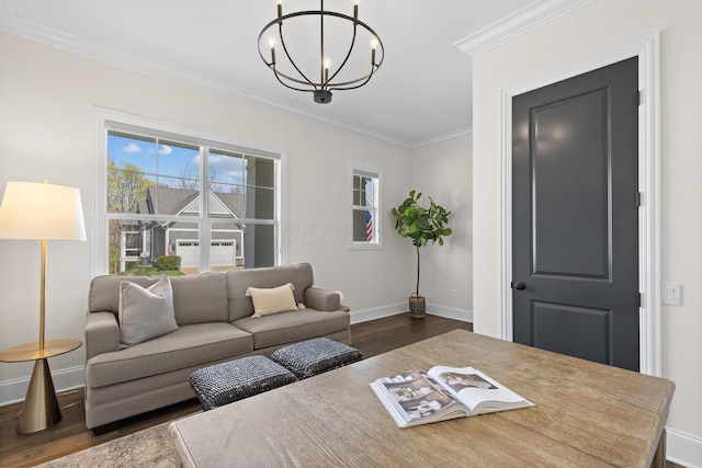 living area featuring crown molding, baseboards, a notable chandelier, and dark wood-style flooring
