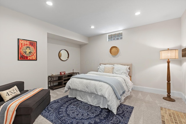 bedroom with light colored carpet and recessed lighting