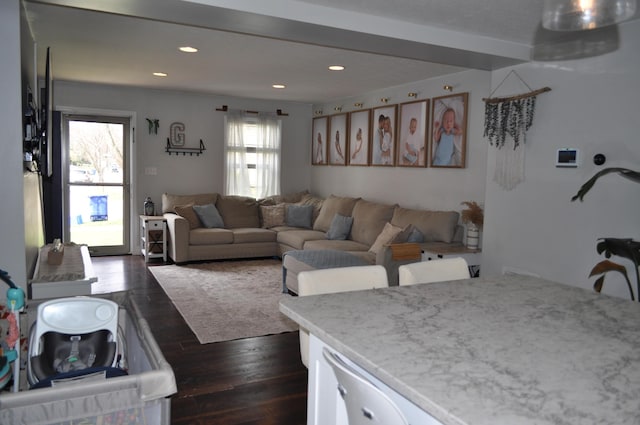 living area with recessed lighting and dark wood-style floors