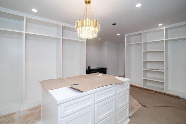 spacious closet with a chandelier